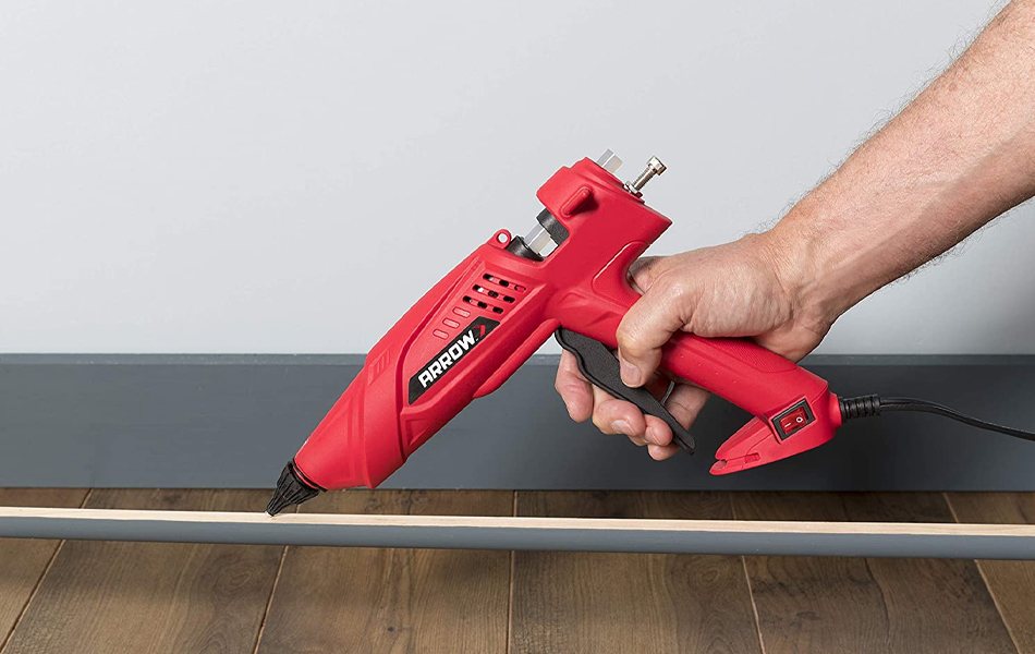 man using glue gun