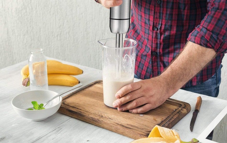 man using immersion blender