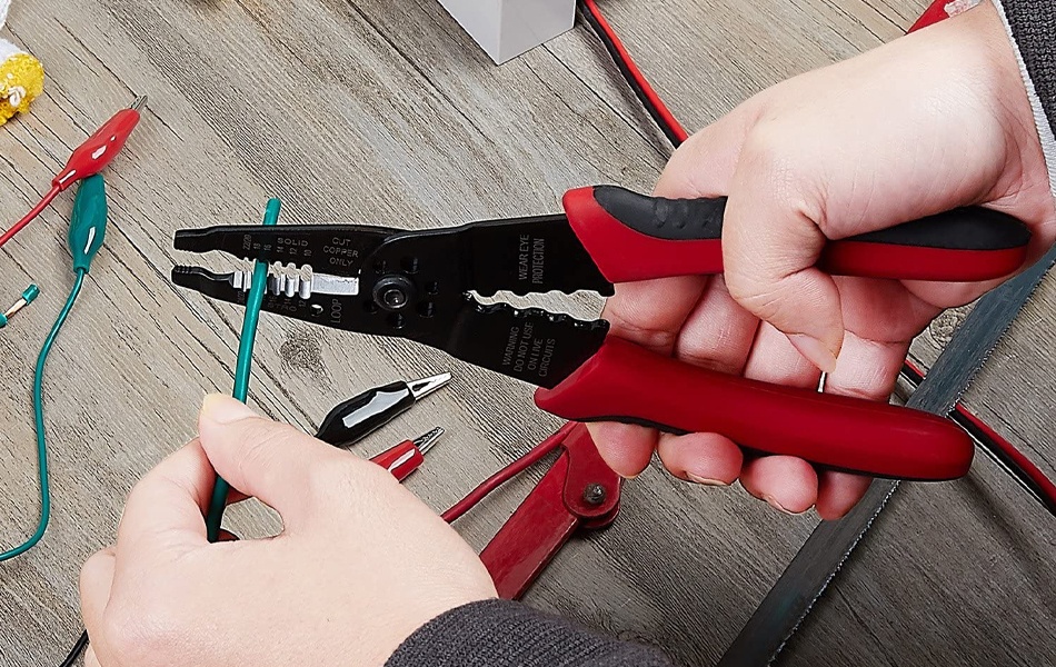 man using wire stripper