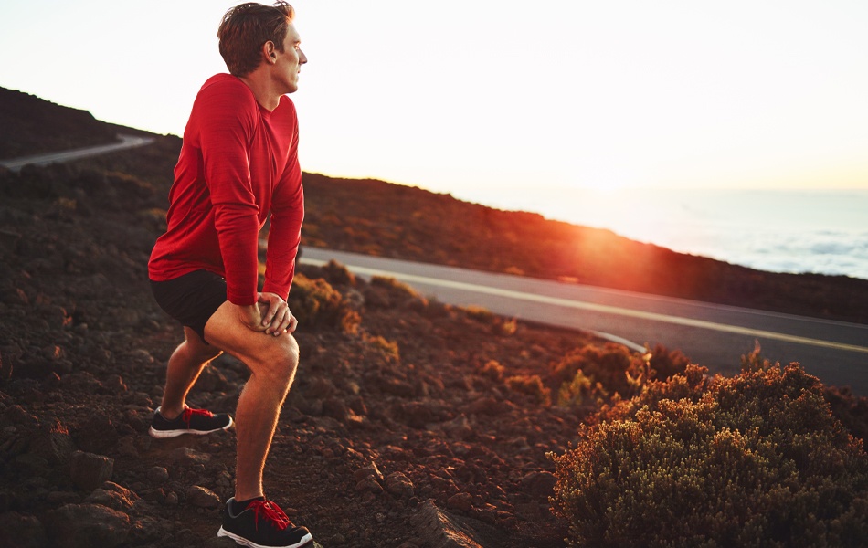 man wearing compression shorts while running