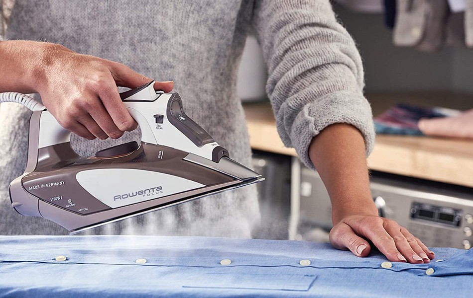 woman using steam iron