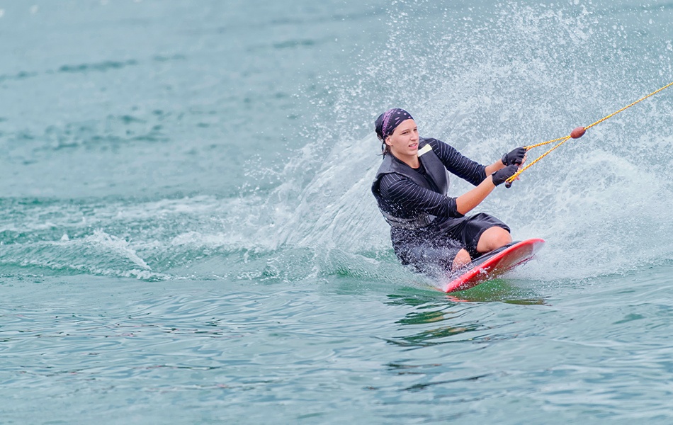 young woman kneeboarding