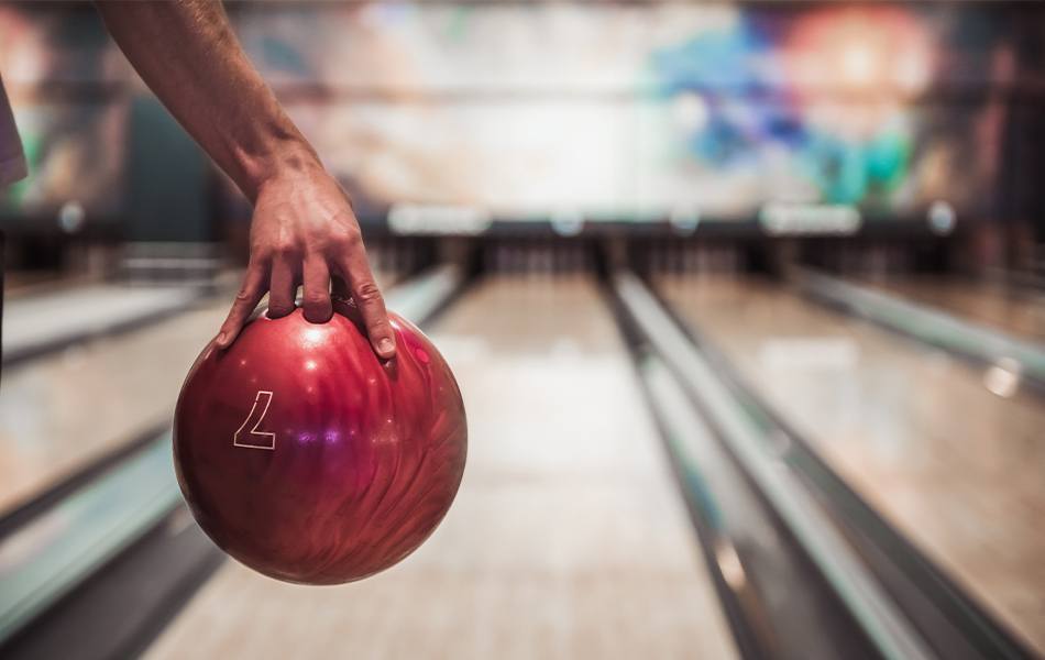 man holding bowling ball