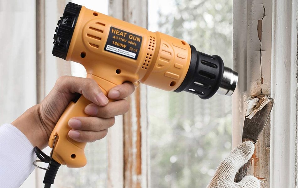 man using heat gun